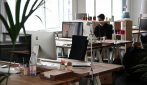 image of an office with people working